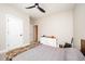 Bedroom features neutral colors, carpet, ceiling fan, and double door closet at 25 Williamston Ridge Dr, Youngsville, NC 27596