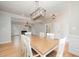 Spacious dining area offers hardwood flooring, a decorative light fixture, and access to living spaces at 25 Williamston Ridge Dr, Youngsville, NC 27596