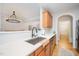 Bright kitchen features wooden cabinets, stainless steel appliances, white countertops, and open to a living space at 25 Williamston Ridge Dr, Youngsville, NC 27596