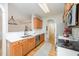 Bright kitchen features wooden cabinets, stainless steel appliances, white countertops and subway tile backsplash at 25 Williamston Ridge Dr, Youngsville, NC 27596
