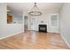 Inviting living room features a black fireplace, hardwood floors, and a walkout to the yard at 25 Williamston Ridge Dr, Youngsville, NC 27596