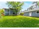 Spacious backyard featuring a lush lawn, exterior of home, deck, and shed at 2517 Medway Dr, Raleigh, NC 27608