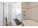 This primary bathroom features modern fixtures, a soaking tub, and glass shower at 2517 Medway Dr, Raleigh, NC 27608