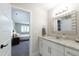 Bright bathroom featuring a white vanity with a granite countertop and modern lighting at 2517 Medway Dr, Raleigh, NC 27608