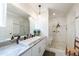Stylish primary bathroom with modern vanity, soaking tub, and glass-enclosed shower at 2517 Medway Dr, Raleigh, NC 27608