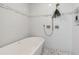 Bright primary bathroom features a soaking tub, sleek shower, and modern design at 2517 Medway Dr, Raleigh, NC 27608