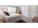 Bedroom featuring a comfortable bed, dresser, and double doors at 2517 Medway Dr, Raleigh, NC 27608