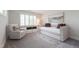 Neutral bedroom featuring a daybed, recliner and decorative rug at 2517 Medway Dr, Raleigh, NC 27608