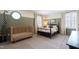 Cozy bedroom featuring a crib, four-poster bed, and a round window for natural light at 2517 Medway Dr, Raleigh, NC 27608