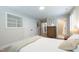 Well-lit bedroom with storage and a bathroom nearby at 2517 Medway Dr, Raleigh, NC 27608