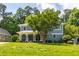 Beautiful two-story home with a spacious yard, inviting front porch, and mature trees at 2517 Medway Dr, Raleigh, NC 27608