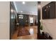 Entryway with hardwood floors, dark trim, and a glimpse into the dining and living spaces at 2517 Medway Dr, Raleigh, NC 27608