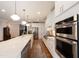 Gourmet kitchen with stainless steel appliances, a large island, and ample cabinet space at 2517 Medway Dr, Raleigh, NC 27608