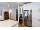 Kitchen with stainless steel refrigerator, ample white cabinetry, and adjacent breakfast nook at 2517 Medway Dr, Raleigh, NC 27608