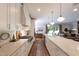 Bright, open kitchen featuring stainless appliances, a large island, and a view of the living area at 2517 Medway Dr, Raleigh, NC 27608