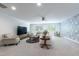 Spacious living room featuring neutral furnishings, recessed lighting and lots of light at 2517 Medway Dr, Raleigh, NC 27608