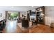 Bright living room featuring a fireplace, built-in shelving, and sliding doors to the patio at 2517 Medway Dr, Raleigh, NC 27608