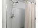 Shower featuring subway tile, brushed nickel fixtures, and a shampoo niche at 2517 Medway Dr, Raleigh, NC 27608