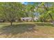 Charming one-story home with mature trees and a well-manicured lawn at 2608 Knightwood Rd, Fuquay Varina, NC 27526