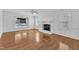 Bright living room with hardwood floors and a cozy fireplace at 2608 Knightwood Rd, Fuquay Varina, NC 27526
