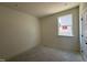 Cozy bedroom with a single window and neutral walls at 2628 Pivot Ridge Dr, Raleigh, NC 27616