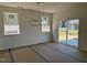 Light-filled dining room with modern chandelier and sliding glass doors to the backyard at 2628 Pivot Ridge Dr, Raleigh, NC 27616