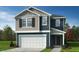 Charming two-story home featuring a two-car garage and a beautifully designed facade with complementary tones at 2628 Pivot Ridge Dr, Raleigh, NC 27616
