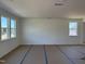 Spacious living room with large windows providing ample natural light at 2628 Pivot Ridge Dr, Raleigh, NC 27616