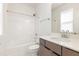 Clean bathroom with modern fixtures, a shower-tub combo, and neutral finishes at 270 Wendover Pkwy, Pittsboro, NC 27312