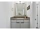 Chic bathroom featuring a gray vanity, framed mirror, and decorative accents at 270 Wendover Pkwy, Pittsboro, NC 27312