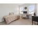 Bedroom with a decorative clock, computer desk, and carpet floors at 270 Wendover Pkwy, Pittsboro, NC 27312