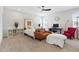Bright bedroom features contemporary furnishings, a ceiling fan, and ample natural light at 270 Wendover Pkwy, Pittsboro, NC 27312