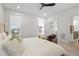 Bright bedroom boasts plush king bed, soft carpet and an ensuite bath at 270 Wendover Pkwy, Pittsboro, NC 27312