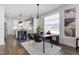 Modern dining room with an elegant table set, complemented by stylish light fixtures at 270 Wendover Pkwy, Pittsboro, NC 27312