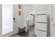 Welcoming entryway featuring modern shoe cabinet, bench seating, and contemporary artwork at 270 Wendover Pkwy, Pittsboro, NC 27312