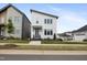 Modern two-story home with white siding, sleek lines, neat landscaping, and a covered front entrance at 270 Wendover Pkwy, Pittsboro, NC 27312