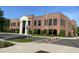 Commercial brick building with large arched windows, imposing columns, and a professionally landscaped lawn at 270 Wendover Pkwy, Pittsboro, NC 27312