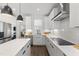 Modern kitchen with white cabinets, stainless steel appliances, and a sleek design at 270 Wendover Pkwy, Pittsboro, NC 27312