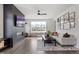Cozy living room features hardwood floors, modern fireplace, and a large window overlooking the outdoors at 270 Wendover Pkwy, Pittsboro, NC 27312