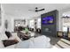 Bright living room featuring a fireplace, hardwood floors, and an open floor plan at 270 Wendover Pkwy, Pittsboro, NC 27312