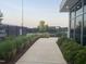 Outdoor pickleball courts with shade and landscaping near the Paddles clubhouse at 270 Wendover Pkwy, Pittsboro, NC 27312