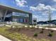 A modern YMCA with vibrant architecture next to a sparkling outdoor pool and lush landscaping at 270 Wendover Pkwy, Pittsboro, NC 27312