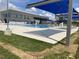 Large community pool with shaded lounging areas, ample seating, and pristine turquoise water at 270 Wendover Pkwy, Pittsboro, NC 27312