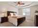 Comfortable bedroom features neutral carpet, ceiling fan, and bright window at 2737 Casper Creek Ln, Raleigh, NC 27616