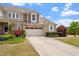 Charming two-story home boasts a well-manicured lawn and inviting curb appeal with blooming flowers at 2737 Casper Creek Ln, Raleigh, NC 27616