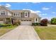 Home with driveway, 2-car garage, manicured lawn, landscaping, and attractive facade at 2737 Casper Creek Ln, Raleigh, NC 27616
