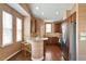 Stylish kitchen with hardwood floors, stainless steel appliances, custom cabinets, and eat in breakfast bar at 2737 Casper Creek Ln, Raleigh, NC 27616