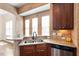 Stylish kitchen with hardwood floors, stainless steel appliances, custom cabinets, and eat in breakfast bar at 2737 Casper Creek Ln, Raleigh, NC 27616