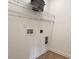 Simple laundry room with wire shelving and hookups at 2737 Casper Creek Ln, Raleigh, NC 27616