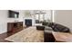 Cozy living room features a fireplace, plush seating, and stylish decor accents at 2737 Casper Creek Ln, Raleigh, NC 27616